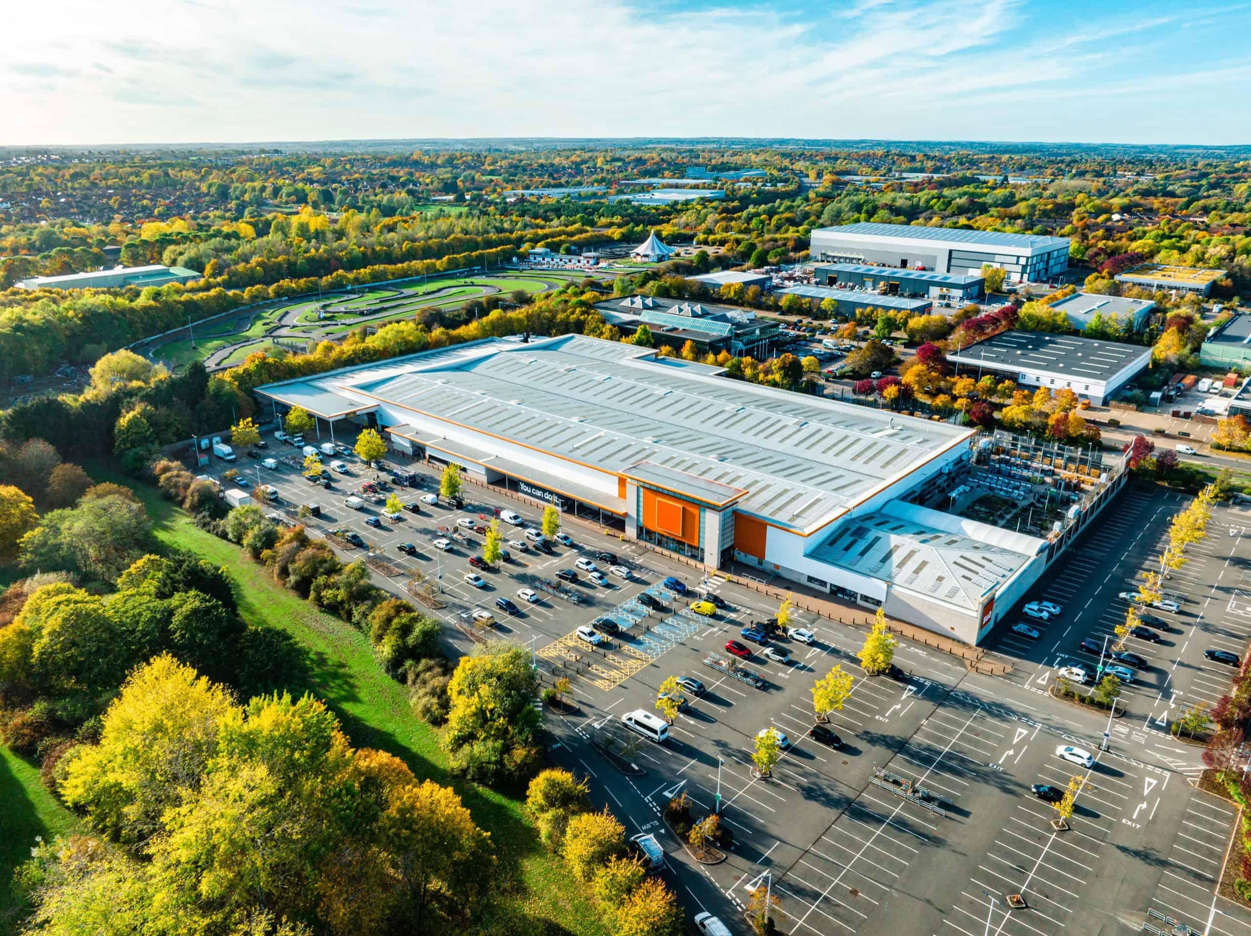 A high-angle view of a large retail building, showcasing its multi-story structure and operational spaces, emphasizing retail facility management.